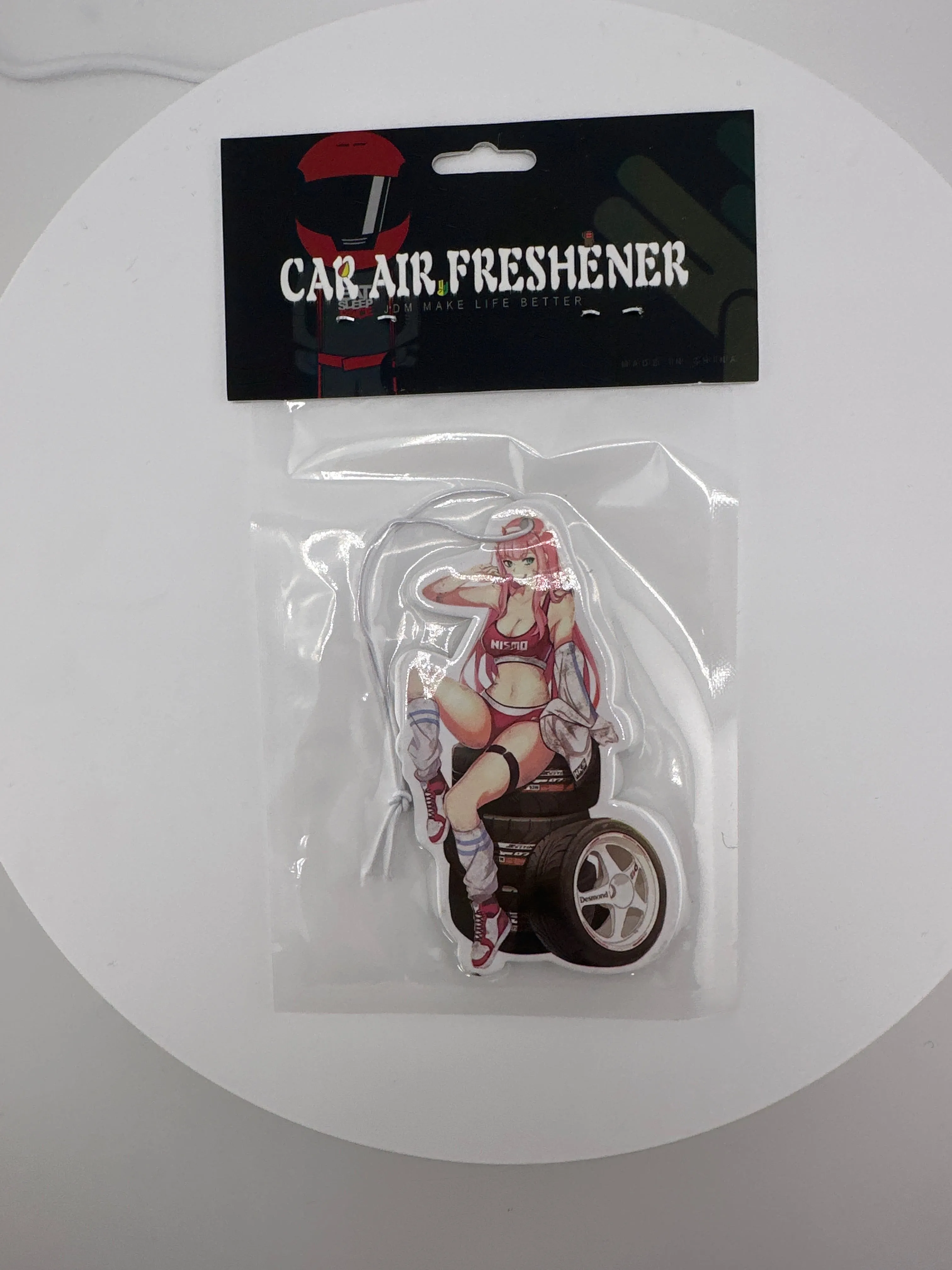 Cute anime waifu sitting on tire’s air freshener